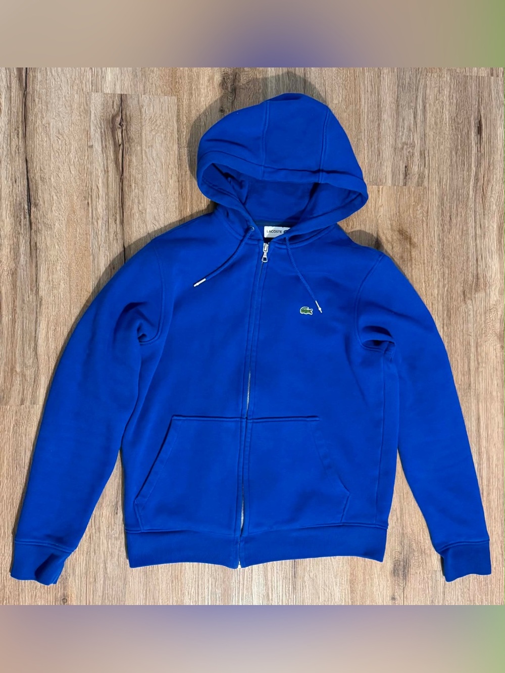 Lacoste men's zip-up fleece hoodies in blue.